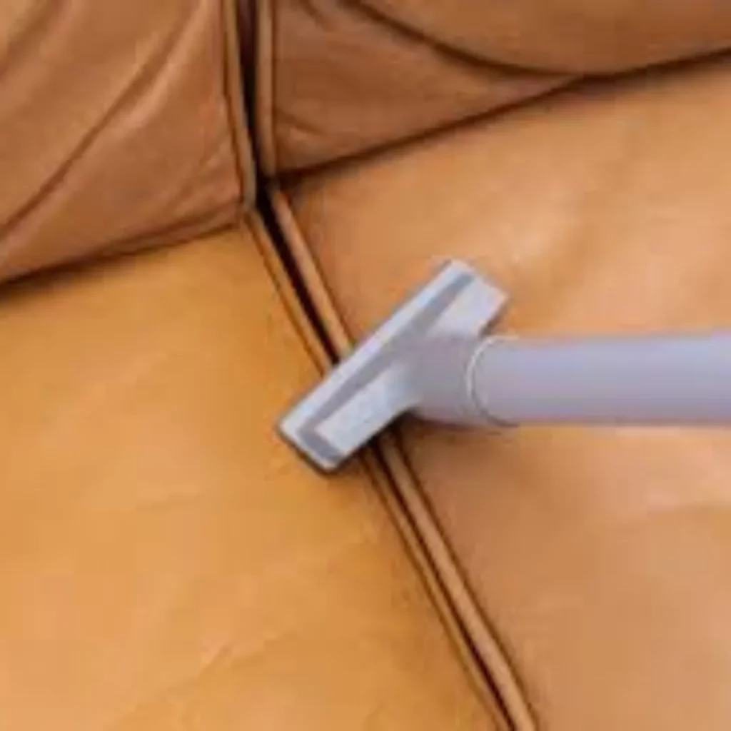 vacuuming, leather couch vacuuming